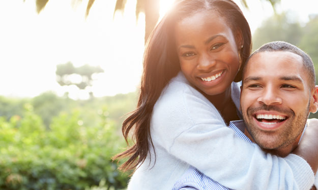 Portrait Of Loving African American Couple In Countryside